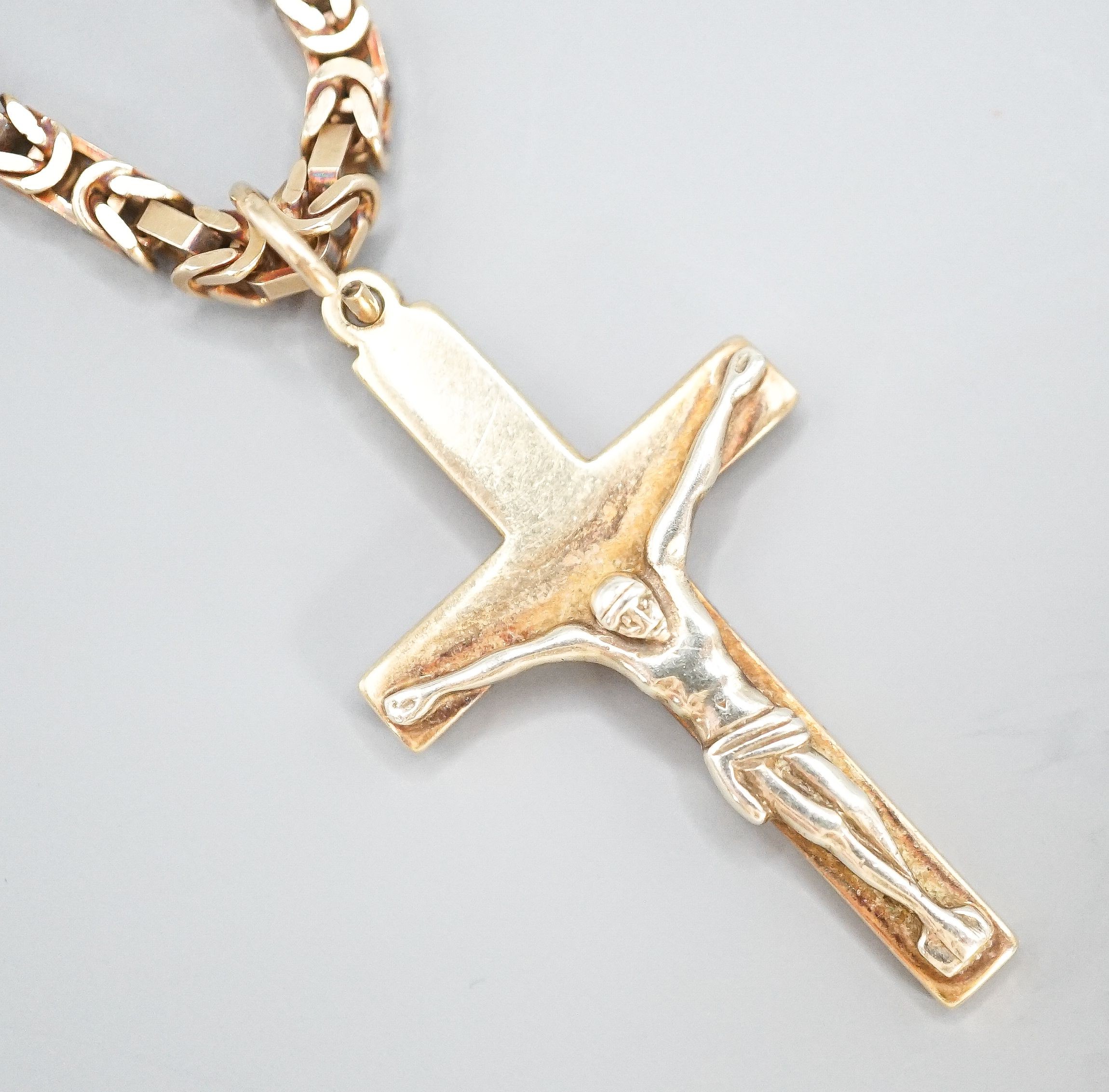 A 9ct gold crucifix pendant, 37mm, on a 9ct gold chain, 47cm